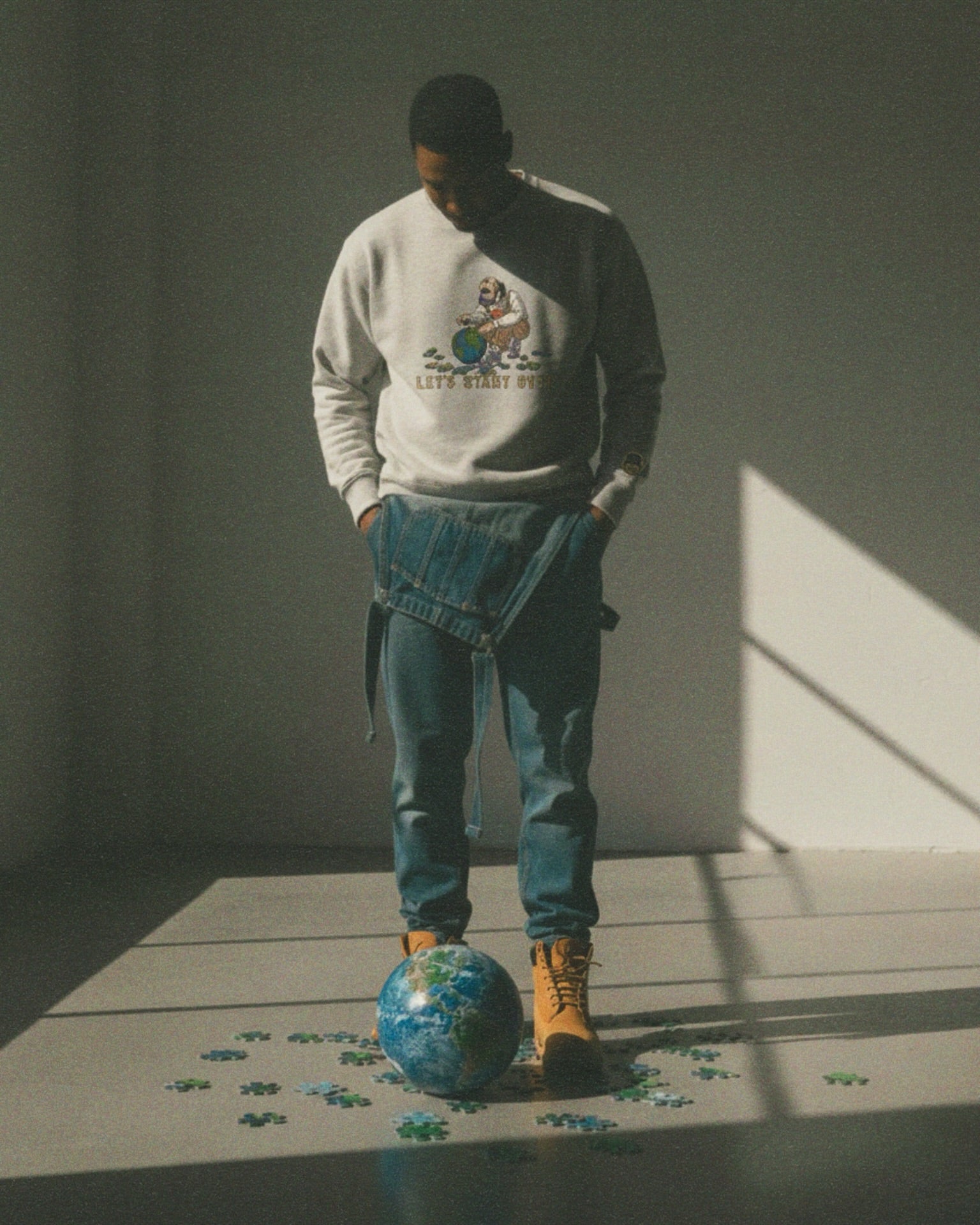 Person standing on a small globe with a minimal background